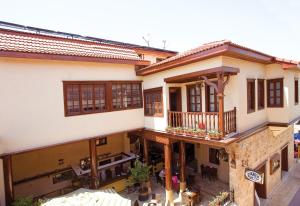 an aerial view of a house with a balcony at Cicerone Lodge Hotel in Antalya