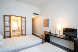 Postel nebo postele na pokoji v ubytování Novotel Vilnius Centre