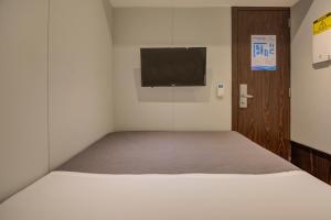 FAST SLEEP Guarulhos by Slaviero Hotéis客房内的一张或多张床位