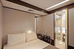 FAST SLEEP Guarulhos by Slaviero Hotéis客房内的一张或多张床位
