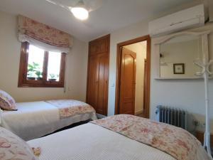 Posteľ alebo postele v izbe v ubytovaní Casa Alfonso Toledo Más que una casa, un hogar