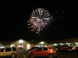 a firework display in a parking lot at night at Pacer Inn & Suites Motel in Delaware