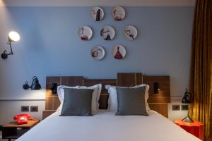 Letto o letti in una camera di Urban Hive Milano