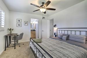 a bedroom with a bed and a ceiling fan at Palm Desert Vacation Rental with Pool Access! in Palm Desert