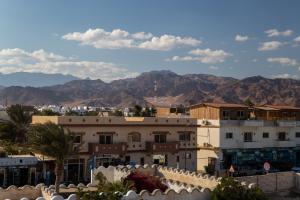 a view of a city with mountains in the background at Al Deira Dahab Hotel in Dahab