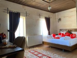 Postel nebo postele na pokoji v ubytování Virtus Cappadocia Hotel Göreme