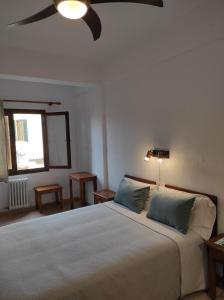 Posteľ alebo postele v izbe v ubytovaní Hostal Nadal