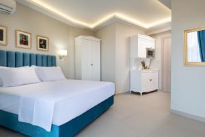 Postel nebo postele na pokoji v ubytování Light Blue Hotel