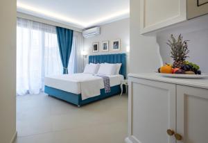 Postel nebo postele na pokoji v ubytování Light Blue Hotel