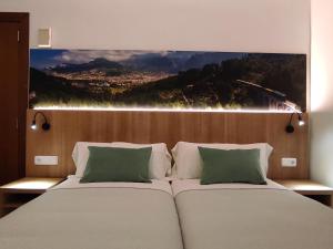 Posteľ alebo postele v izbe v ubytovaní Hostal Nadal