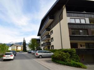 a parking lot with cars parked next to a building at Studio Leif by Interhome in Zell am See