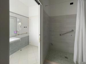 a bathroom with a shower with a shower curtain at La Lanterna in Silvi Marina