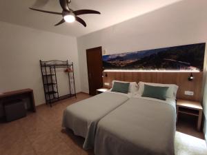 Posteľ alebo postele v izbe v ubytovaní Hostal Nadal