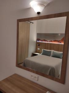 Posteľ alebo postele v izbe v ubytovaní Hostal Nadal