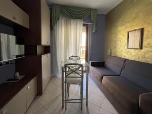 a living room with a couch and a table at La Lanterna in Silvi Marina