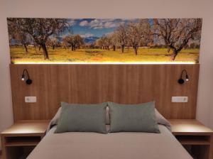 Posteľ alebo postele v izbe v ubytovaní Hostal Nadal