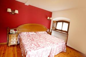 A bed or beds in a room at Puente Romano