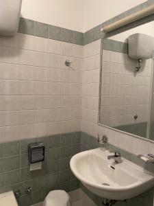 a bathroom with a sink and a mirror at La Lanterna in Silvi Marina