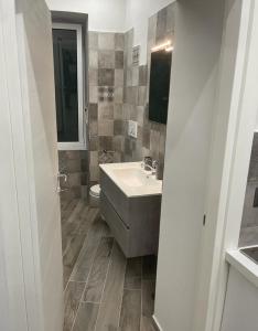 a bathroom with a sink and a toilet at La Casina di Michele a Napoli in Naples