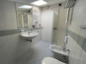 a bathroom with a toilet and a sink at La Lanterna in Silvi Marina
