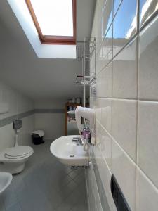 a bathroom with a sink and a toilet at La Lanterna in Silvi Marina