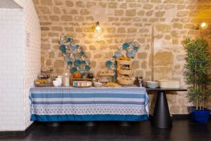 a table with a blue and white table cloth at Hotel Victoria in Paris