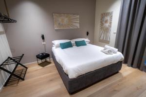 A bed or beds in a room at Pasubio Quattro BB