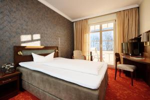 Postel nebo postele na pokoji v ubytování Hotel Mohren