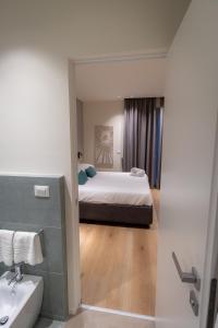 A bed or beds in a room at Pasubio Quattro BB