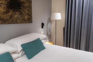 A bed or beds in a room at Pasubio Quattro BB