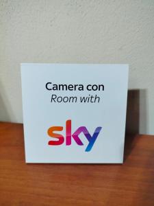 a sign for a room with skype on a table at Hotel Le Botti in Guarene