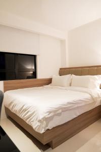 Postel nebo postele na pokoji v ubytování D Loft Hotel