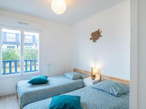 Ένα ή περισσότερα κρεβάτια σε δωμάτιο στο Apartment Xabadenia-4 by Interhome