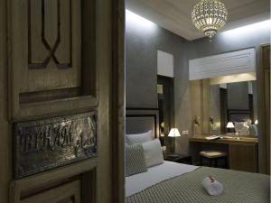 Voodi või voodid majutusasutuse Riad L'Etoile D'Orient toas