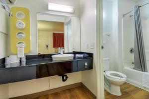a bathroom with a sink and a toilet and a mirror at Motel 6-Chino, CA - Los Angeles Area in Chino