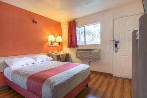 a hotel room with a bed and a window at Motel 6-Chino, CA - Los Angeles Area in Chino