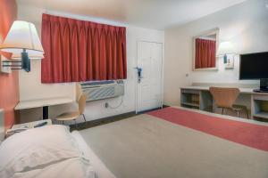 a hotel room with a bed and a desk and a window at Motel 6-Chino, CA - Los Angeles Area in Chino