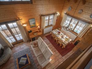 an overhead view of a living room and dining room at Chalet Le Sorbier by Interhome in Chamoson