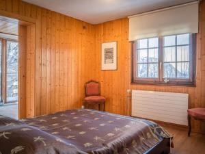 Cama o camas de una habitación en Chalet Le Sorbier by Interhome