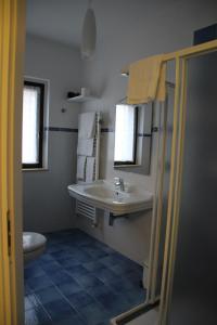 a bathroom with a sink and a toilet at Prati di Maja B&B in Miglianico +51 photos