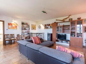 a living room with two couches and a television at Holiday Home Lory House by Interhome in Villa Viani