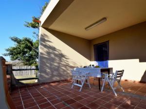 a patio with a table and chairs on a patio at Holiday Home Cecilia by Interhome in Santa Maria del Focallo