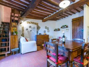 a dining room with a wooden table and chairs at Holiday Home Casa Patrizia by Interhome in Monsanto