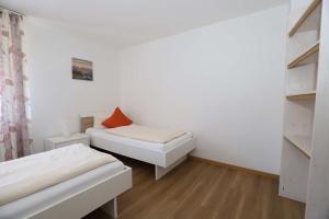 Postel nebo postele na pokoji v ubytování KAISERS das kleine Stadthotel