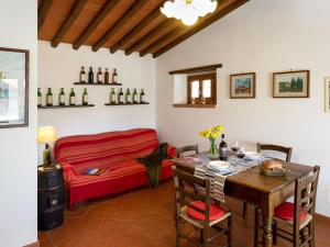 a dining room with a table and a bed at Holiday Home Casa Mario by Interhome in Greve in Chianti