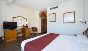 TV a/nebo společenská místnost v ubytování Hotel MS Tropicana
