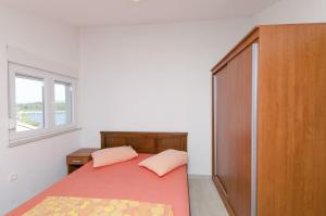 Posteľ alebo postele v izbe v ubytovaní Apartment Ivo