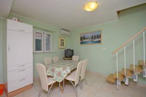 a dining room with a table and chairs at House Marija in Lastovo