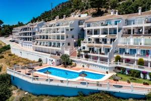 an aerial view of a large apartment building with a swimming pool at Mirador De Mijas Luxury Apt Blq 6 Mijas in Mijas