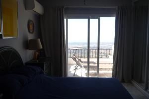 A bed or beds in a room at Stunning Views Mirador de Mijas Apt